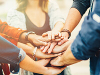 Hands piled on top of each other 