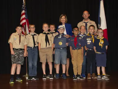A group of Boy Scouts receiving an award